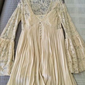 Free People mini dress with long lace bell sleeves.